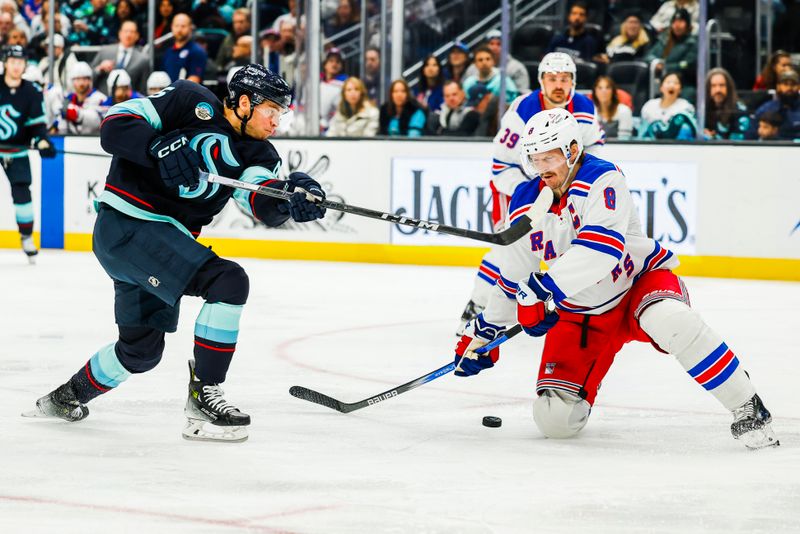 Nov 17, 2024; Seattle, Washington, USA; New York Rangers defenseman Jacob Trouba (8) blocks a shot attempt by Seattle Kraken left wing Andre Burakovsky (95) during the third period at Climate Pledge Arena. Mandatory Credit: Joe Nicholson-Imagn Images