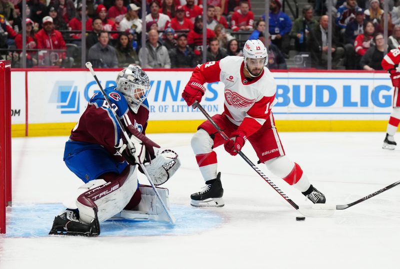 Mar 6, 2024; Denver, Colorado, USA; Detroit Red Wings center Robby Fabbri (14) shoots and scores on Colorado Avalanche goaltender Alexandar Georgiev (40) in the first period at Ball Arena. Mandatory Credit: Ron Chenoy-USA TODAY Sports