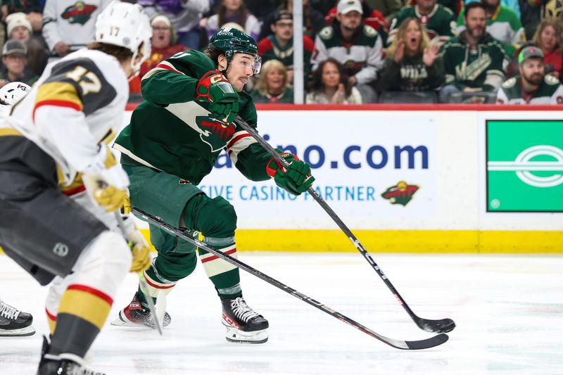 Apr 3, 2023; Saint Paul, Minnesota, USA; Minnesota Wild right wing Brandon Duhaime (21) shoots against the Vegas Golden Knights during the second period at Xcel Energy Center. Mandatory Credit: Matt Krohn-USA TODAY Sports