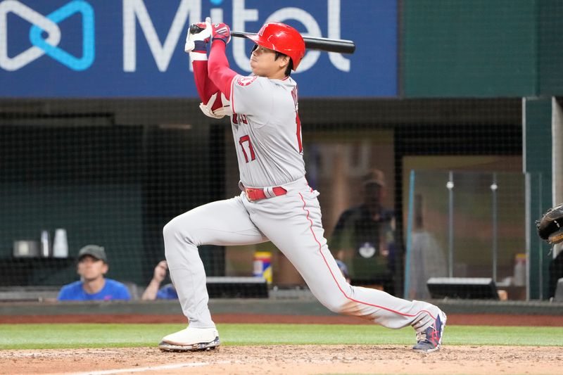 Apr 14, 2022; Arlington, Texas, USA; Los Angeles Angels designated hitter Shohei Ohtani (17) follows through for a double against the Texas Rangers during the ninth inning of a baseball game at Globe Life Field. Mandatory Credit: Jim Cowsert-USA TODAY Sports