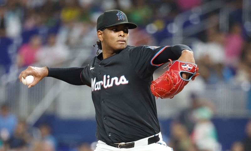 Aug 9, 2024; Miami, Florida, USA;  Miami Marlins starting pitcher Edward Cabrera (27) delivers a pitch against the San Diego Padres in the first inning at loanDepot Park. Mandatory Credit: Rhona Wise-USA TODAY Sports