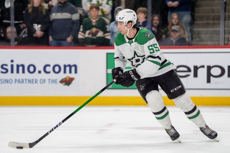 Apr 6, 2025; Saint Paul, Minnesota, USA; Dallas Stars defenseman Thomas Harley (55) skates with the puck against the Minnesota Wild in overtime at Xcel Energy Center. Mandatory Credit: Matt Blewett-Imagn Images