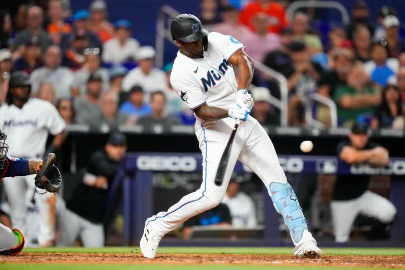 Aug 14, 2023; Miami, Florida, USA; Miami Marlins designated hitter Jorge Soler (12) hits a home run against the Houston Astros during the eighth inning at loanDepot Park. Mandatory Credit: Rich Storry-USA TODAY Sports