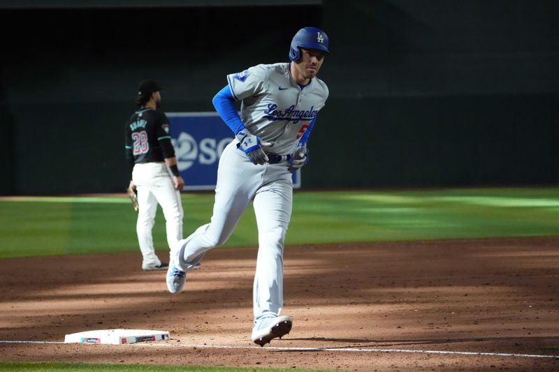 Sep 2, 2024; Phoenix, Arizona, USA; Los Angeles Dodgers first base Freddie Freeman (5) runs the bases after hitting a home run against the Arizona Diamondbacks during the eighth inning at Chase Field. Mandatory Credit: Joe Camporeale-USA TODAY Sports