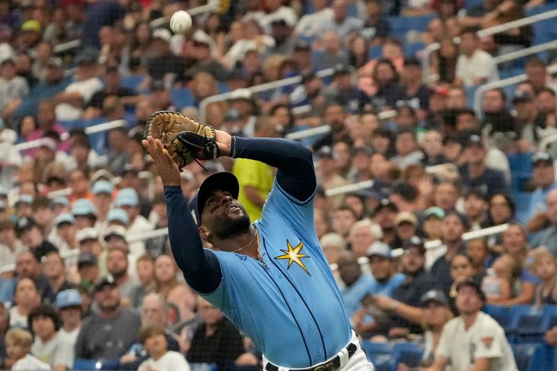 Apr 2, 2023; St. Petersburg, Florida, USA; Tampa Bay Rays first baseman Yandy Diaz (2) catches a foul ball hit by Detroit Tigers third baseman Nick Maton (9) during the fifth inning at Tropicana Field. Mandatory Credit: Dave Nelson-USA TODAY Sports