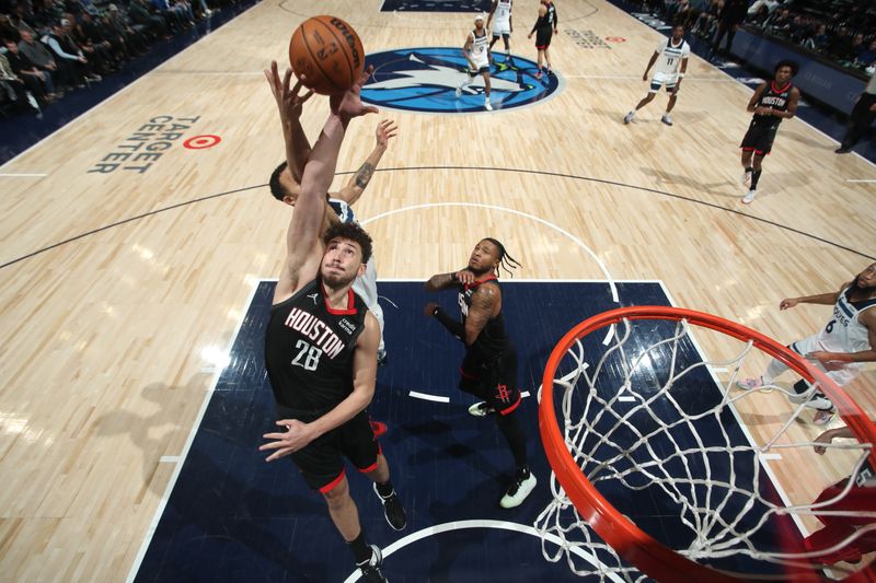 MINNEAPOLIS, MN -  FEBRUARY 4: Alperen Sengun #28 of the Houston Rockets grabs a rebound during the game against the Minnesota Timberwolves on February 4, 2024 at Target Center in Minneapolis, Minnesota. NOTE TO USER: User expressly acknowledges and agrees that, by downloading and or using this Photograph, user is consenting to the terms and conditions of the Getty Images License Agreement. Mandatory Copyright Notice: Copyright 2024 NBAE (Photo by Jordan Johnson/NBAE via Getty Images)