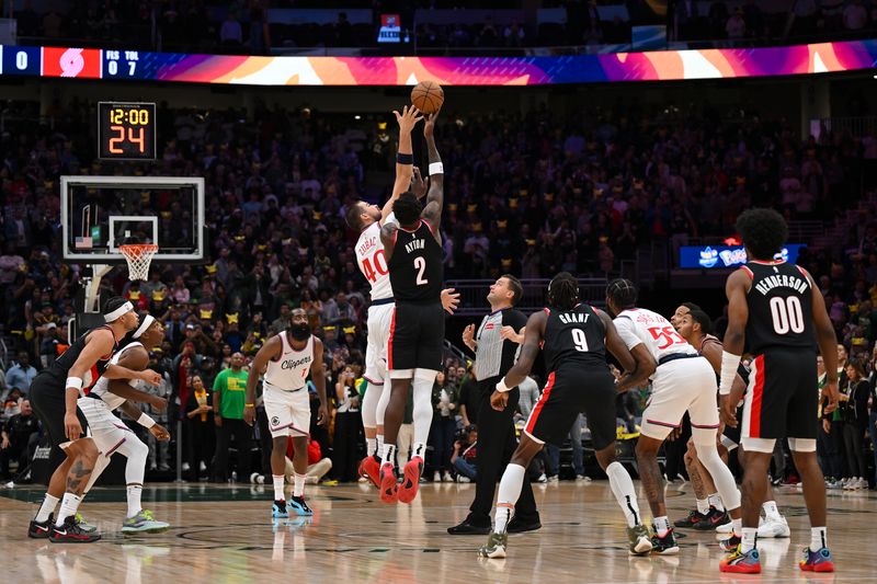 SEATTLE, WASHINGTON - OCTOBER 11: Ivica Zubac #40 of the LA Clippers and Deandre Ayton #2 of the Portland Trail Blazers jockey for the tipoff during the first quarter of the Rain City Showcase game at Climate Pledge Arena on October 11, 2024 in Seattle, Washington. NOTE TO USER: User expressly acknowledges and agrees that, by downloading and or using this photograph, User is consenting to the terms and conditions of the Getty Images License Agreement. (Photo by Alika Jenner/Getty Images)