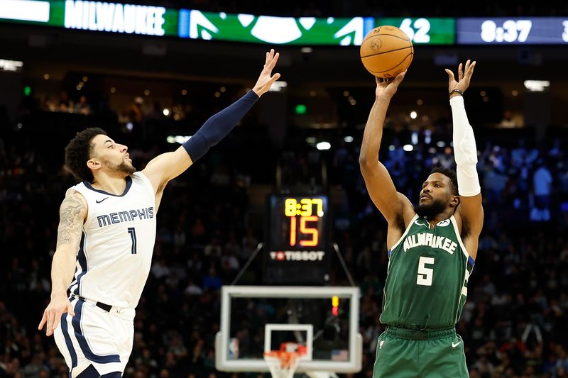 MILWAUKEE, WISCONSIN - APRIL 03: Malik Beasley #5 of the Milwaukee Bucks shoots against Scotty Pippen Jr. #1 of the Memphis Grizzlies during the second half of the game at Fiserv Forum on April 03, 2024 in Milwaukee, Wisconsin. NOTE TO USER: User expressly acknowledges and agrees that, by downloading and or using this photograph, User is consenting to the terms and conditions of the Getty Images License Agreement. (Photo by John Fisher/Getty Images)