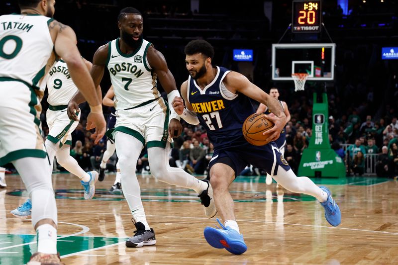 BOSTON, MA - JANUARY 19: Jamal Murray #27 of the Denver Nuggets drives past Jaylen Brown #7 of the Boston Celtics during the second quarter at TD Garden on January 19, 2024 in Boston, Massachusetts. NOTE TO USER: User expressly acknowledges and agrees that, by downloading and/or using this Photograph, user is consenting to the terms and conditions of the Getty Images License Agreement. (Photo By Winslow Townson/Getty Images)