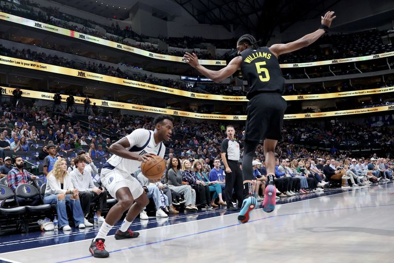 DALLAS, TEXAS - OCTOBER 10: Olivier-Maxence Prosper #8 of the Dallas Mavericks drives to the basket against Cody Williams #5 of the Utah Jazz in the first half at American Airlines Center on October 10, 2024 in Dallas, Texas. NOTE TO USER: User expressly acknowledges and agrees that, by downloading and or using this Photograph, user is consenting to the terms and conditions of the Getty Images License Agreement. Mandatory Copyright Notice: Copyright 2024 NBAE (Photo by Tim Heitman/Getty Images)