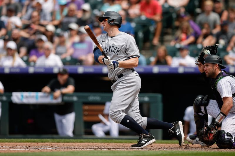 Jul 16, 2023; Denver, Colorado, USA; New York Yankees third baseman DJ LeMahieu (26) hits a single in the sixth inning against the Colorado Rockies at Coors Field. Mandatory Credit: Isaiah J. Downing-USA TODAY Sports