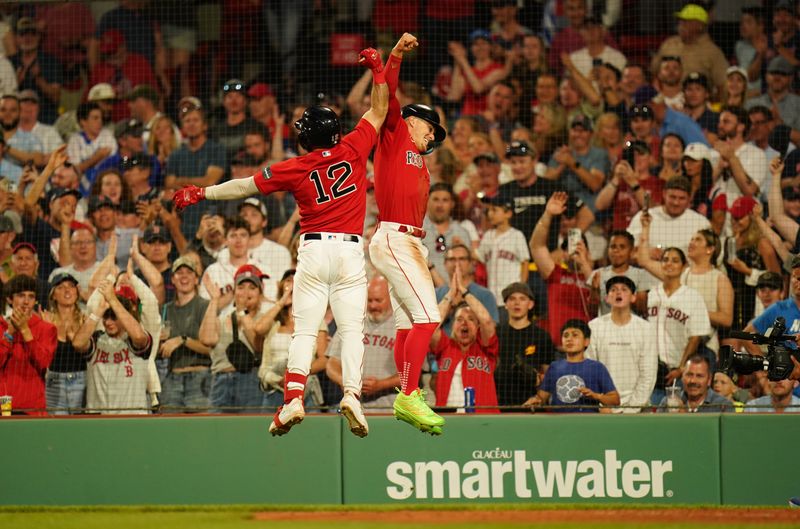 Jun 1, 2023; Boston, Massachusetts, USA; Boston Red Sox catcher Connor Wong (12) celebrates his two run home run with shortstop Enrique Hernandez (5) against the Cincinnati Reds in the eighth inning at Fenway Park. Mandatory Credit: David Butler II-USA TODAY Sports