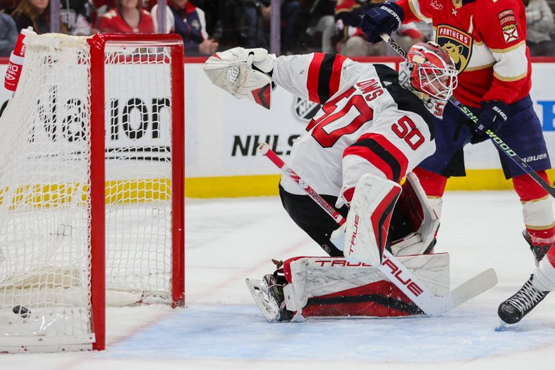 Jan 13, 2024; Sunrise, Florida, USA; New Jersey Devils goaltender Nico Daws (50) cannot make and gets scored on by Florida Panthers center Sam Reinhart (not pictured) during the second period at Amerant Bank Arena. Mandatory Credit: Sam Navarro-USA TODAY Sports