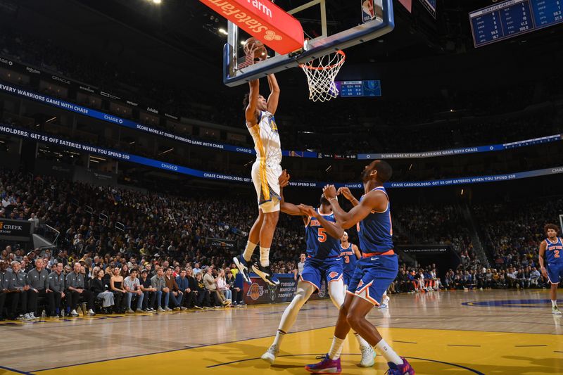 SAN FRANCISCO, CA - MARCH 18: Trayce Jackson-Davis #32 of the Golden State Warriors  drives to the basket during the game against the New York Knicks on MARCH 18, 2024 at Chase Center in San Francisco, California. NOTE TO USER: User expressly acknowledges and agrees that, by downloading and or using this photograph, user is consenting to the terms and conditions of Getty Images License Agreement. Mandatory Copyright Notice: Copyright 2024 NBAE (Photo by Noah Graham/NBAE via Getty Images)