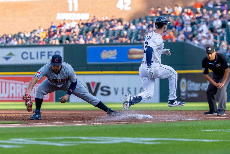 Jul 29, 2024; Detroit, Michigan, USA; Cleveland Guardians first baseman Josh Naylor (22) catches the ball as Detroit Tigers first baseman Mark Canha (21) is out to end the first inning at Comerica Park. Mandatory Credit: David Reginek-USA TODAY Sports