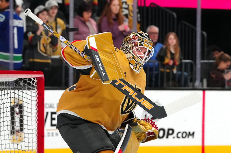 Mar 7, 2024; Las Vegas, Nevada, USA; Vegas Golden Knights goaltender Adin Hill (33) warms up before a game against the Vancouver Canucks at T-Mobile Arena. Mandatory Credit: Stephen R. Sylvanie-USA TODAY Sports