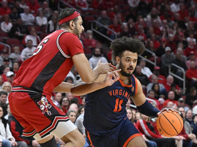 Jan 13, 2026; Louisville, Kentucky, USA;  Virginia Cavaliers forward Devin Tillis (11) dribbles against Louisville Cardinals center Aly Khalifa (15) during the first half at KFC Yum! Center. Mandatory Credit: Jamie Rhodes-Imagn Images