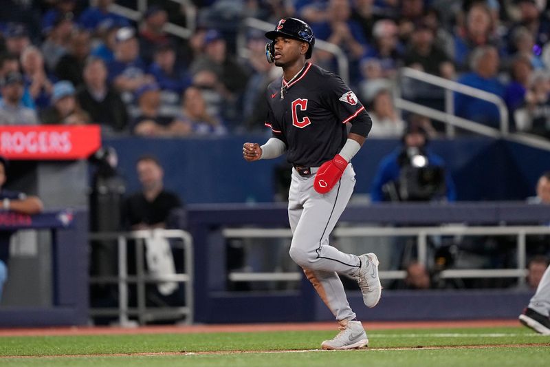 May 4, 2025; Toronto, Ontario, CAN; Cleveland Guardians center fielder Angel Martinez (1) is walked home by Toronto Blue Jays pitcher Brendon Little (not pictured) during the ninth inning at Rogers Centre. Mandatory Credit: John E. Sokolowski-Imagn Images