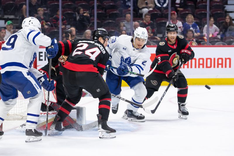 Sep 24, 2024; Ottawa, Ontario, CAN; Toronto Maple Leafs left wing Matthew Knies (23) skates past Ottawa Senators defensemen Jacob Bernard-Docker (24 and Nick Jensen (3) as he chases the puck in the second period at the Canadian Tire Centre. Mandatory Credit: Marc DesRosiers-Imagn Images