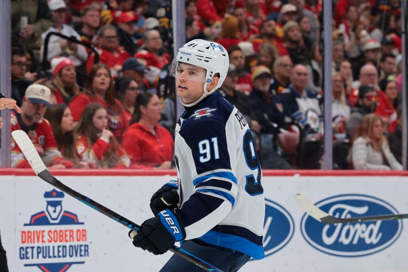 Jan 31, 2026; Sunrise, Florida, USA; Winnipeg Jets center Cole Perfetti (91) celebrates after scoring against the Florida Panthers during the third period at Amerant Bank Arena. Mandatory Credit: Sam Navarro-Imagn Images