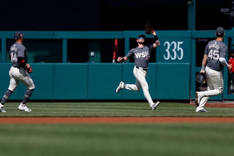 Jun 15, 2024; Washington, District of Columbia, USA;Washington Nationals outfielder Lane Thomas (28) catches fly ball by Miami Marlins first base Josh Bell (not pictured) during the first inning  at Nationals Park. Mandatory Credit: Geoff Burke-USA TODAY Sports