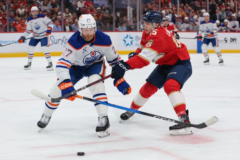 Nov 22, 2025; Sunrise, Florida, USA;  Florida Panthers center Anton Lundell (15) defends against Edmonton Oilers defenseman Brett Kulak (27) during the first period at Amerant Bank Arena. Mandatory Credit: Sam Navarro-Imagn Images