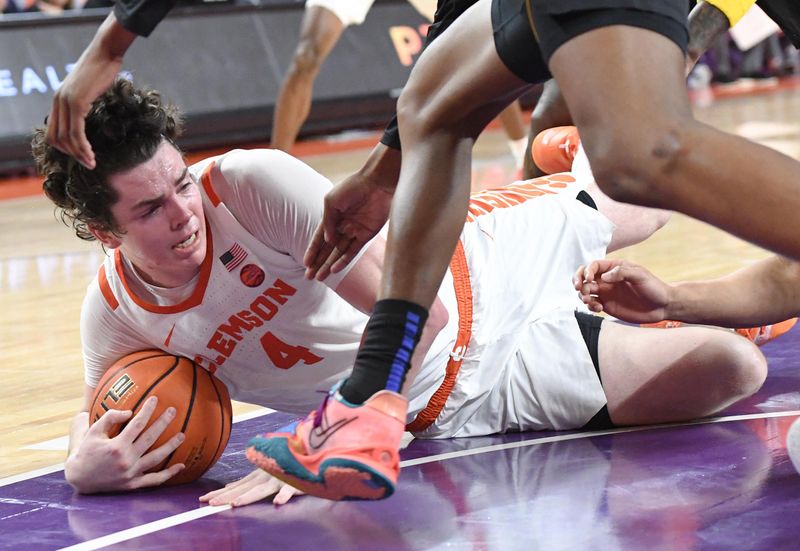 Feb 27, 2024; Clemson, South Carolina, USA;  Clemson junior forward Ian Schieffelin (4) grabs a loose ball on the floor playing Pitt during the first half at Littlejohn Coliseum. Mandatory Credit: Ken Ruinard-USA TODAY Sports