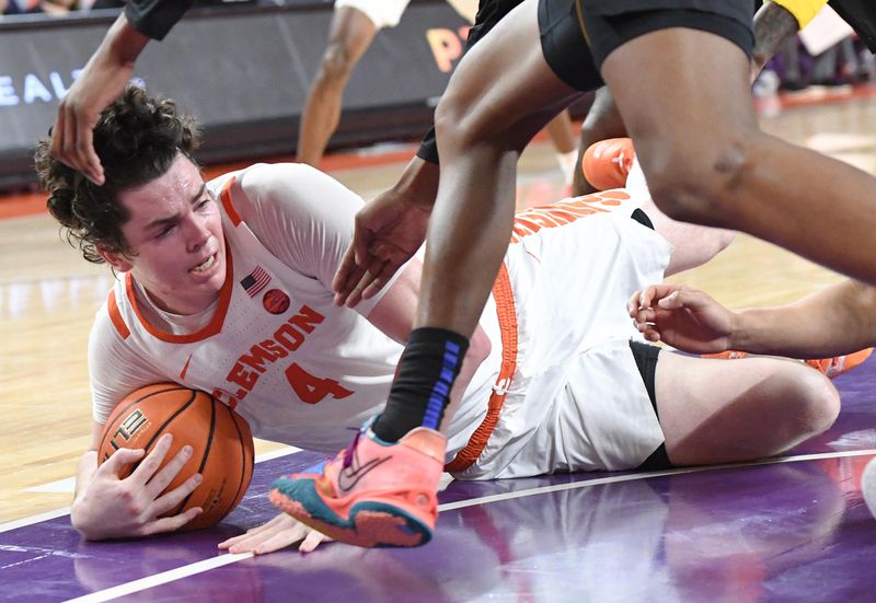 Feb 27, 2024; Clemson, South Carolina, USA;  Clemson junior forward Ian Schieffelin (4) grabs a loose ball on the floor playing Pitt during the first half at Littlejohn Coliseum. Mandatory Credit: Ken Ruinard-USA TODAY Sports