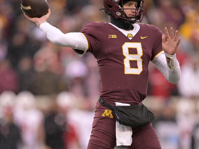 Nov 25, 2023; Minneapolis, Minnesota, USA;  Minnesota Golden Gophers quarterback Athan Kaliakmanis (8) makes a throw against the Wisconsin Badgers during the second quarter at Huntington Bank Stadium. Mandatory Credit: Nick Wosika-USA TODAY Sports