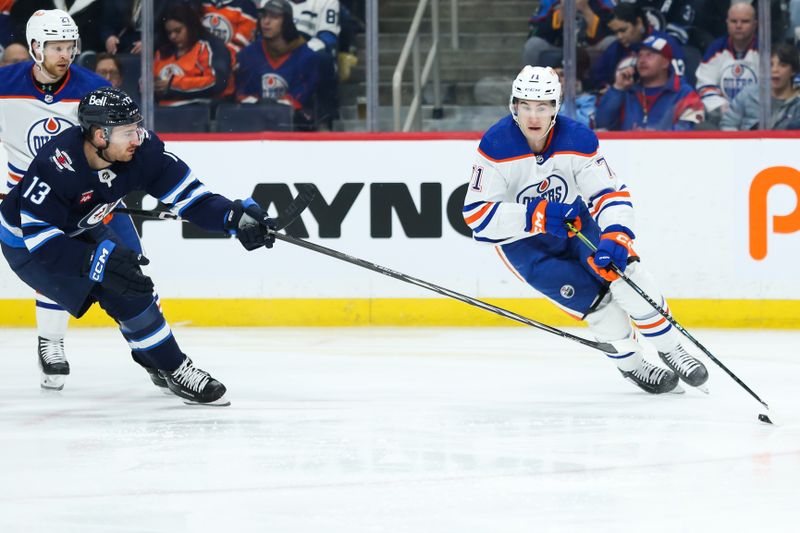 Nov 30, 2023; Winnipeg, Manitoba, CAN; Edmonton Oilers forward Ryan McLeod (71) skates away from Winnipeg Jets forward Gabriel Vilardi (13) during the second period at Canada Life Centre. Mandatory Credit: Terrence Lee-USA TODAY Sports