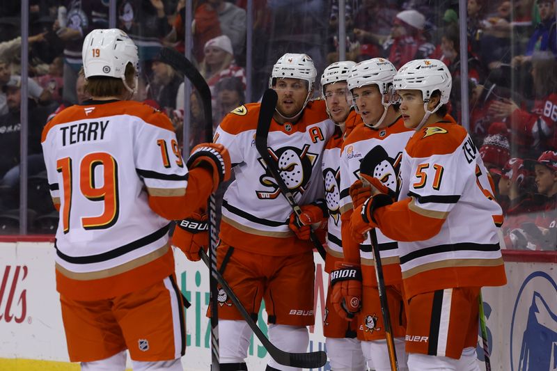 Oct 27, 2024; Newark, New Jersey, USA; Anaheim Ducks left wing Brock McGinn (26) celebrates his goal against the New Jersey Devils during the first period at Prudential Center. Mandatory Credit: Ed Mulholland-Imagn Images