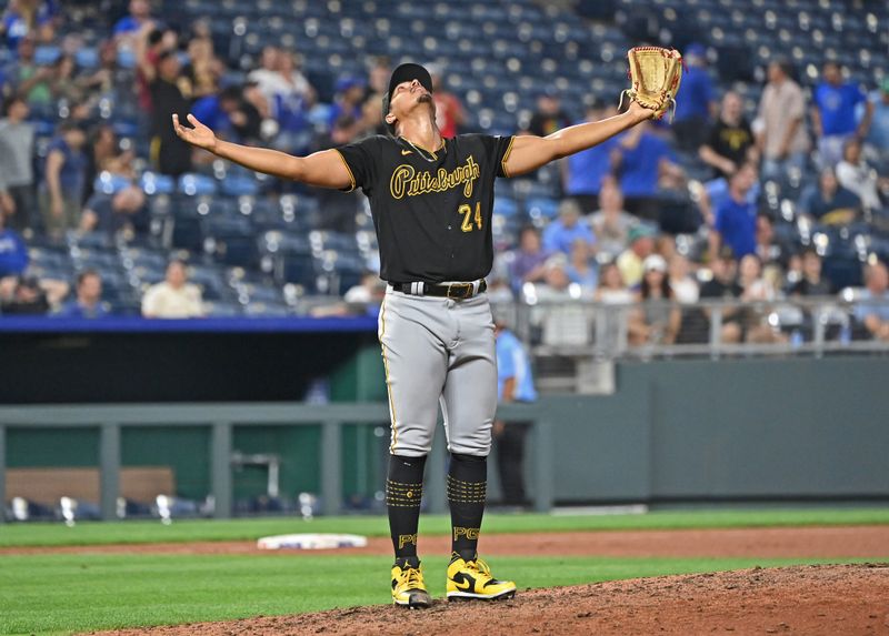 Aug 28, 2023; Kansas City, Missouri, USA;  Pittsburgh Pirates starting pitcher Johan Oviedo (24) celebrates after throwing a complete game shutout to beat the Kansas City Royals at Kauffman Stadium. Mandatory Credit: Peter Aiken-USA TODAY Sports