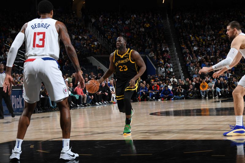 SAN FRANCISCO, CA - FEBRUARY 14: Draymond Green #23 of the Golden State Warriors dribbles the ball during the game against the LA Clippers on FEBRUARY 14, 2024 at Chase Center in San Francisco, California. NOTE TO USER: User expressly acknowledges and agrees that, by downloading and or using this photograph, user is consenting to the terms and conditions of Getty Images License Agreement. Mandatory Copyright Notice: Copyright 2024 NBAE (Photo by Noah Graham/NBAE via Getty Images)