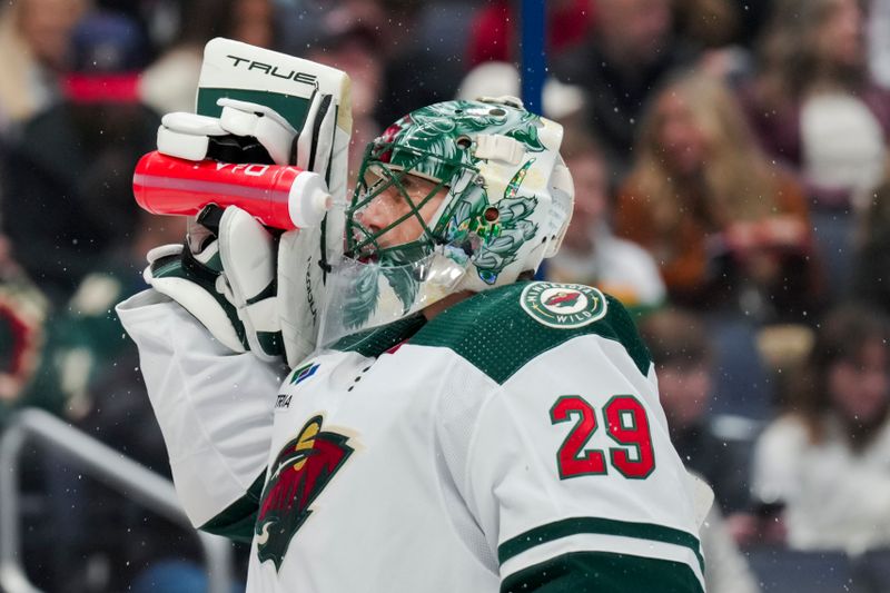 Jan 6, 2024; Columbus, Ohio, USA;  Minnesota Wild goaltender Marc-Andre Fleury (29) sprays his face with his water bottle during a stop in play against the Columbus Blue Jackets in the first period at Nationwide Arena. Mandatory Credit: Aaron Doster-USA TODAY Sports