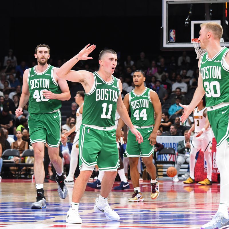 ABU DHABI, UAE - OCTOBER 4: Payton Pritchard #11 of the Boston Celtics celebrates during the game against the Denver Nuggets during the 2024 Global Games on October 4, 2024 at the Etihad Arena in Abu Dhabi, United Arab Emirates. NOTE TO USER: User expressly acknowledges and agrees that, by downloading and/or using this Photograph, user is consenting to the terms and conditions of the Getty Images License Agreement. Mandatory Copyright Notice: Copyright 2024 NBAE (Photo by Brian Babineau/NBAE via Getty Images)