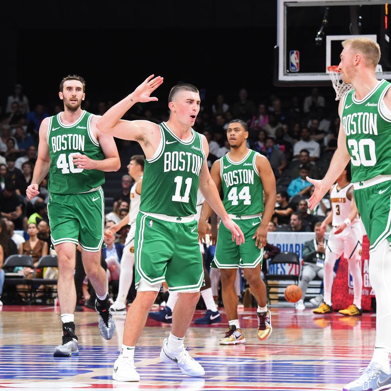 ABU DHABI, UAE - OCTOBER 4: Payton Pritchard #11 of the Boston Celtics celebrates during the game against the Denver Nuggets during the 2024 Global Games on October 4, 2024 at the Etihad Arena in Abu Dhabi, United Arab Emirates. NOTE TO USER: User expressly acknowledges and agrees that, by downloading and/or using this Photograph, user is consenting to the terms and conditions of the Getty Images License Agreement. Mandatory Copyright Notice: Copyright 2024 NBAE (Photo by Brian Babineau/NBAE via Getty Images)