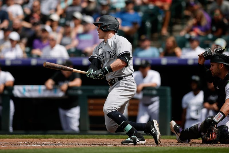 Jul 16, 2023; Denver, Colorado, USA; New York Yankees center fielder Harrison Bader (22) hits a single in the sixth inning against the Colorado Rockies at Coors Field. Mandatory Credit: Isaiah J. Downing-USA TODAY Sports