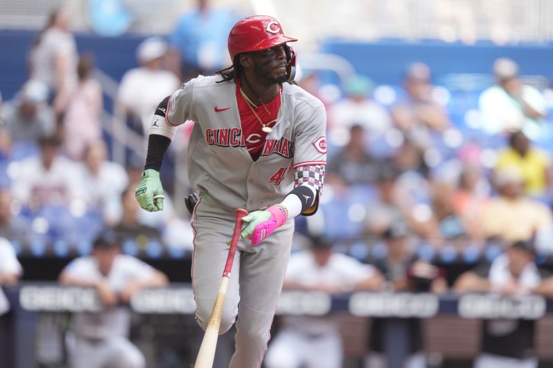 Apr 23, 2025; Miami, Florida, USA;  Cincinnati Reds shortstop Elly De La Cruz (44) hits a single in the eighth inning against the Miami Marlins at loanDepot Park. Mandatory Credit: Jim Rassol-Imagn Images