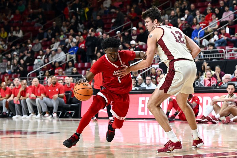 Feb 11, 2023; Chestnut Hill, Massachusetts, USA; North Carolina State Wolfpack guard Jarkel Joiner (1) drives to the basket against Boston College Eagles forward Quinten Post (12)  during the first half at the Conte Forum. Mandatory Credit: Brian Fluharty-USA TODAY Sports