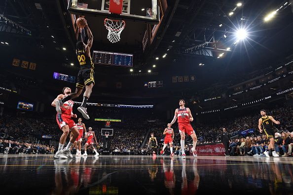 SAN FRANCISCO, CA - DECEMBER 22: Jonathan Kuminga #00 of the Golden State Warriors drives to the basket during the game against the Washington Wizards on December 22, 2023 at Chase Center in San Francisco, California. NOTE TO USER: User expressly acknowledges and agrees that, by downloading and or using this photograph, user is consenting to the terms and conditions of Getty Images License Agreement. Mandatory Copyright Notice: Copyright 2023 NBAE (Photo by Noah Graham/NBAE via Getty Images)