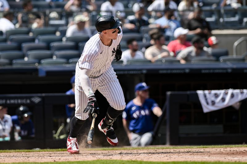 Aug 10, 2024; Bronx, New York, USA; New York Yankees outfielder Aaron Judge (99) hits a RBI single against the Texas Rangers during the fourth inning at Yankee Stadium. Mandatory Credit: John Jones-USA TODAY Sports