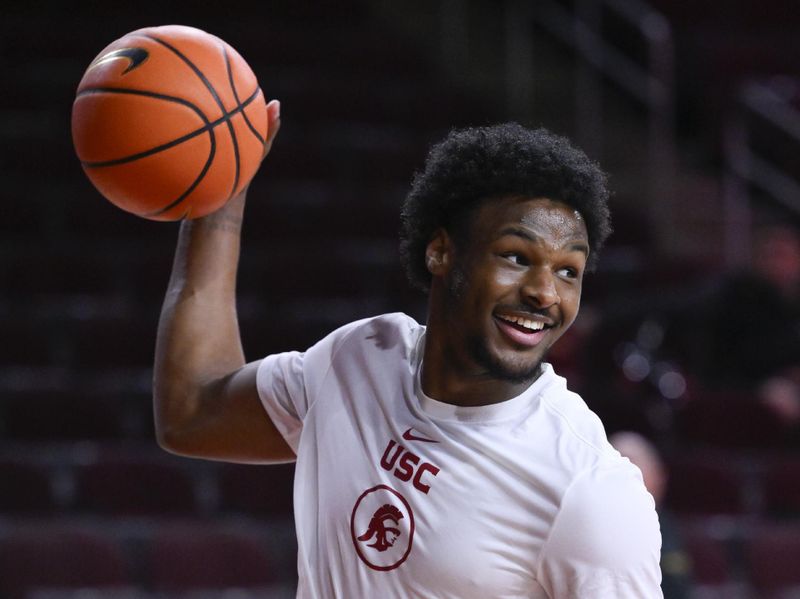 Dec 10, 2023; Los Angeles, California, USA; USC Trojans guard Bronny James is all smiles during pre-game warmups before a game against the Long Beach State 49er at Galen Center. Mandatory Credit: Robert Hanashiro-USA TODAY Sports