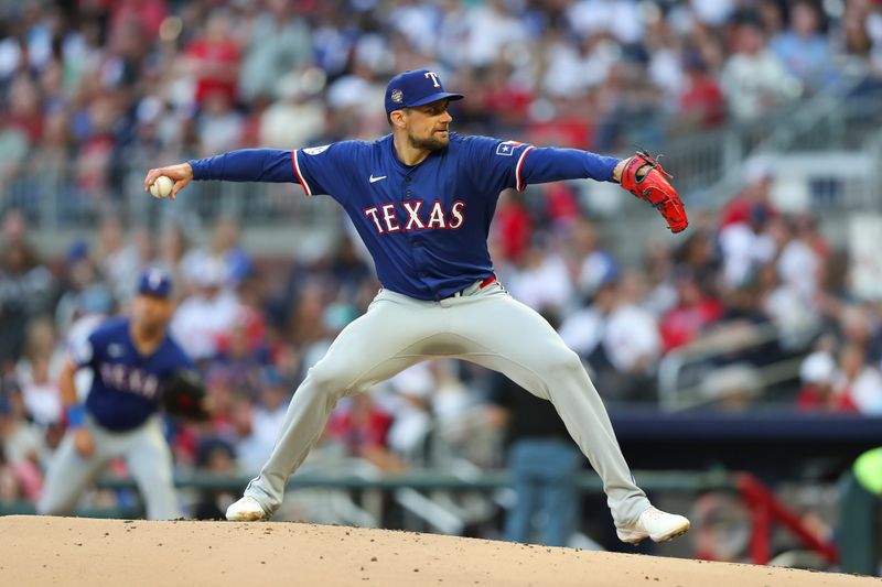 Apr 20, 2024; Cumberland, Georgia, USA; Texas Rangers starting pitcher Nathan Eovaldi (17) pitches against the Atlanta Braves in the first inning at Truist Park. Mandatory Credit: Mady Mertens-USA TODAY Sports