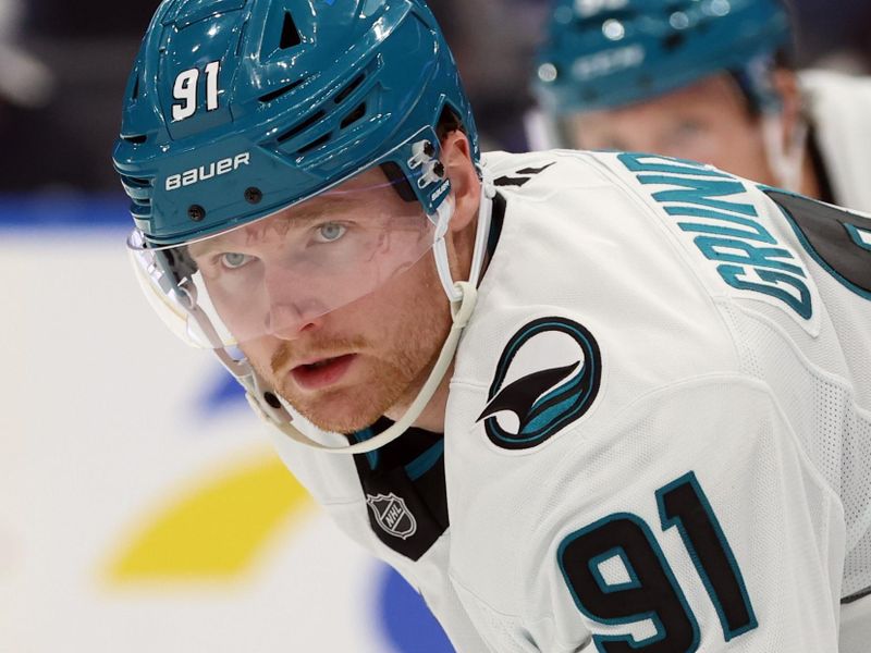 Dec 5, 2024; Tampa, Florida, USA; San Jose Sharks right wing Carl Grundstrom (91) looks on against the Tampa Bay Lightning during the third period at Amalie Arena. Mandatory Credit: Kim Klement Neitzel-Imagn Images