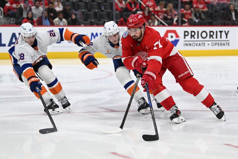 Nov 21, 2024; Detroit, Michigan, USA; Detroit Red Wings center Dylan Larkin (71) tries to skate past New York Islanders defenseman Noah Dobson (8) and defenseman Alexander Romanov (28) in the second period at Little Caesars Arena. Mandatory Credit: Lon Horwedel-Imagn Images