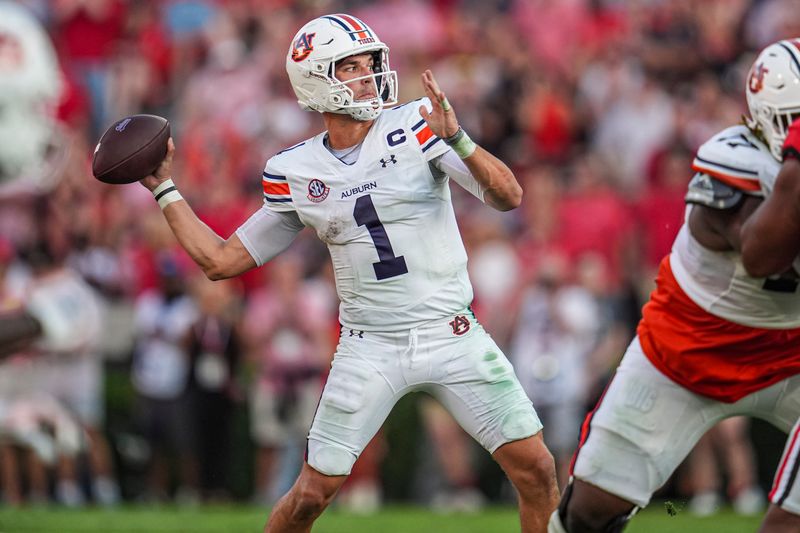 Oct 5, 2024; Athens, Georgia, USA; Auburn Tigers quarterback Payton Thorne (1) passes against the Georgia Bulldogs at Sanford Stadium. Mandatory Credit: Dale Zanine-Imagn Images