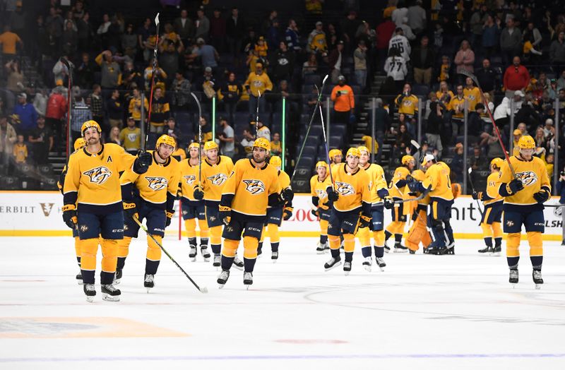 Sep 30, 2022; Nashville, Tennessee, USA;  Nashville Predators celebrates the win against the Tampa Bay Lightning during the third period at Bridgestone Arena. Mandatory Credit: Steve Roberts-USA TODAY Sports