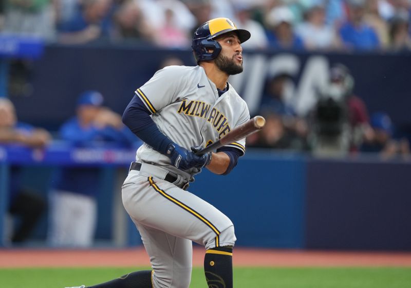 May 31, 2023; Toronto, Ontario, CAN; Milwaukee Brewers third baseman Abraham Toro (13) hits a two-run home run against the Toronto Blue Jays during the second inning at Rogers Centre. Mandatory Credit: Nick Turchiaro-USA TODAY Sports