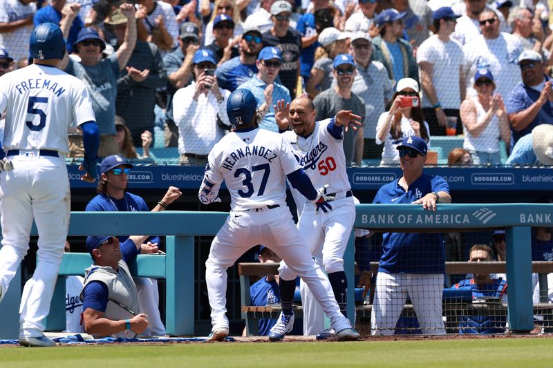 May 8, 2024; Los Angeles, California, USA;  Los Angeles Dodgers outfielder Teoscar Hernandez (37) celebrates with shortstop Mookie Betts (50) after hitting a two-run home run during the sixth inning against the Miami Marlins at Dodger Stadium. Mandatory Credit: Kiyoshi Mio-USA TODAY Sports