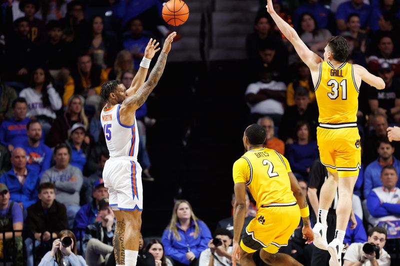 Jan 14, 2025; Gainesville, Florida, USA; Florida Gators guard Alijah Martin (15) attempts a three point basket over Missouri Tigers guard Caleb Grill (31) during the first half at Exactech Arena at the Stephen C. O'Connell Center. Mandatory Credit: Matt Pendleton-Imagn Images